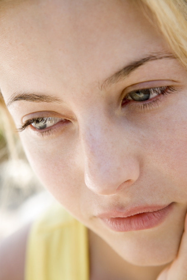 Head shot of woman thinking