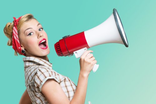 Megaphone. Attractive woman with megaphone